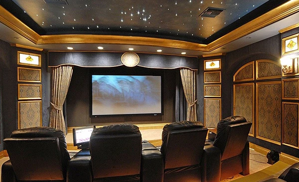 Luxurious home theater room with large screen and comfortable seating, showcasing premium home theater installation services in Palm Beach Gardens, FL.